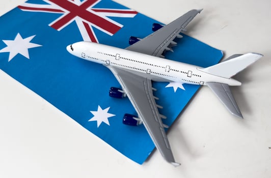 Flag of Australia and toy airplane. Flight travel concept photo