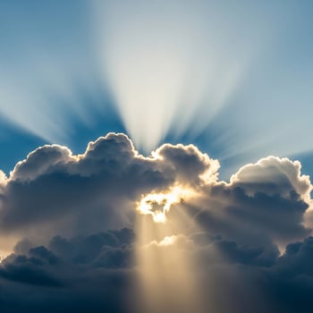 Divine Sun Rays Piercing Through Moody, Silver-Lined Clouds photo