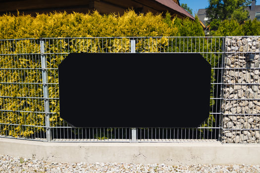 Blank Signboard on Metal Fence in Residential Area photo