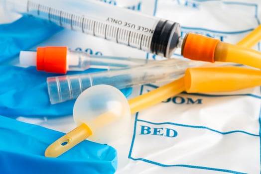Foley catheter and urine drainage bag collect urine for disability photo