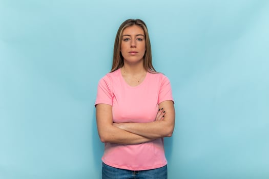 Woman wearing pink t-shirt crossing arms supporting Breast Cancer Awareness photo