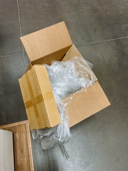 The shipping box contains tightly wrapped plastic that effectively ensures the items inside are wellprepared, safe, and protected during both shipping processes and storage periods photo