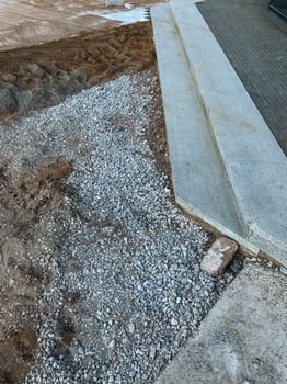 A pile of gravel is sitting on top of a pile of dirt photo