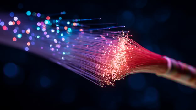 Vibrant strands of light creating a dazzling display of colorful sparks against a dark background in a surreal digital art scene photo