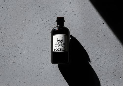 Black Poison Bottle with Long Shadow on Concrete Background photo
