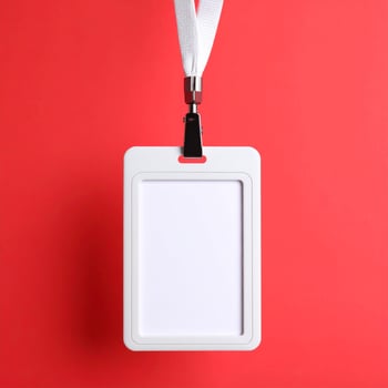 Minimal Blank ID Card Mockup with Neck Lanyard Hanging Against Red Background Empty Identification Card Display photo