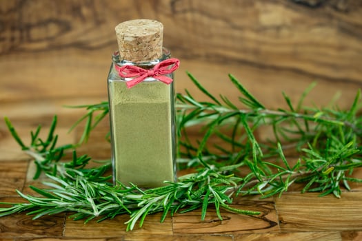 a glas with rosemary powder photo