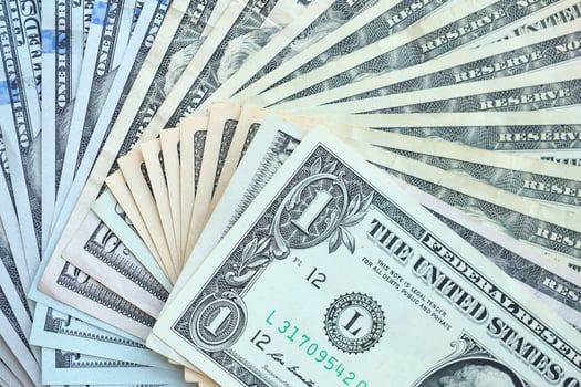 Many different dollar bills lies in big pile photo