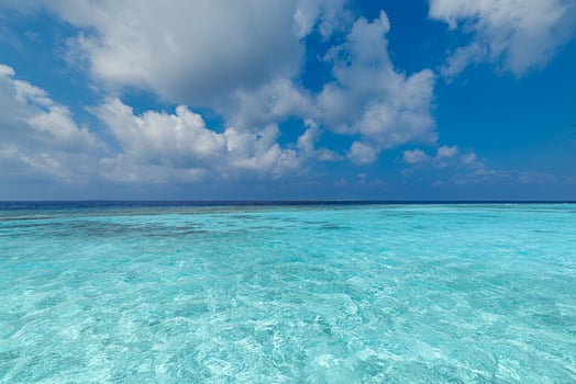 clear blue ocean with clouds photo