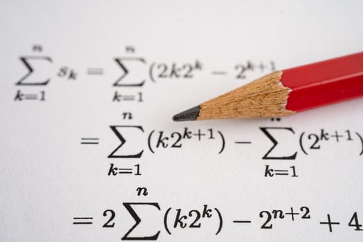 Pencil on mathematic formula test paper photo