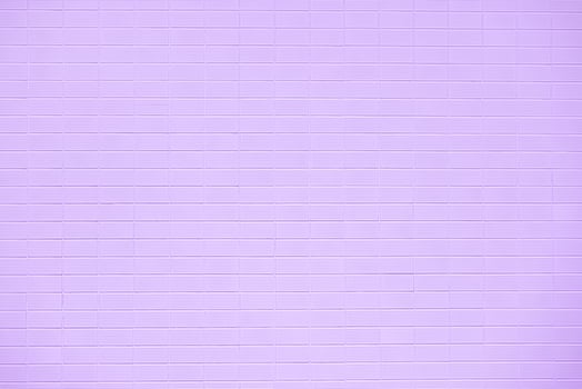Brick wall with purple tiles photo