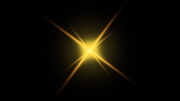 Golden Light Flare, Bright Starburst on Black Background, Overlay Effect photo