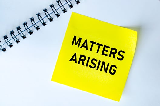 Matters Arising text on yellow notepad. Meeting agenda concept photo