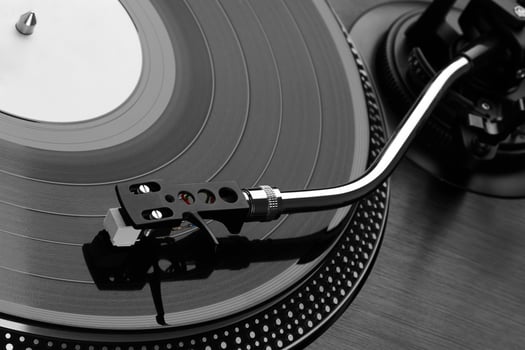 Record player playing vinyl closeup photo
