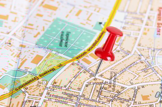 Red pushpin on a map photo