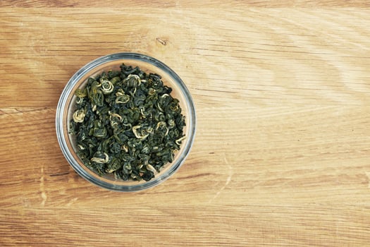 Tea in a bowl on a wood photo