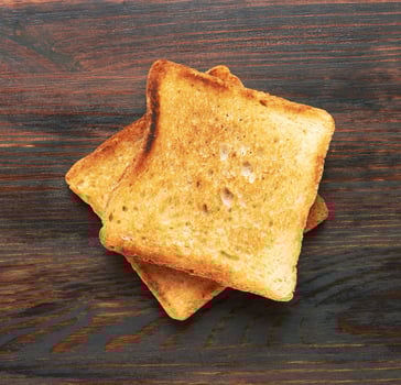 Toasts on wooden background photo