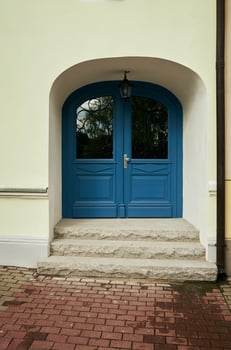 Blue door with a white archway photo