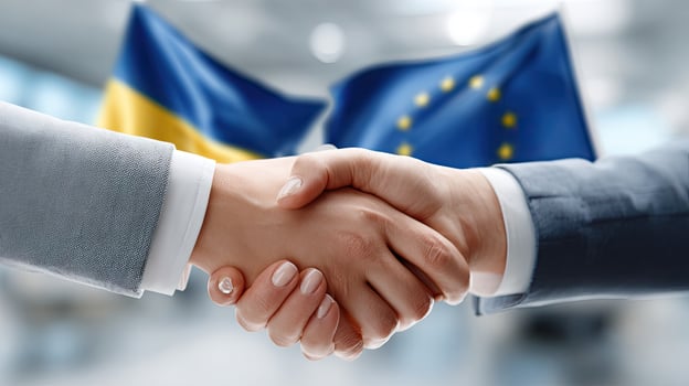 Ukraine and european union flags shaking hands photo