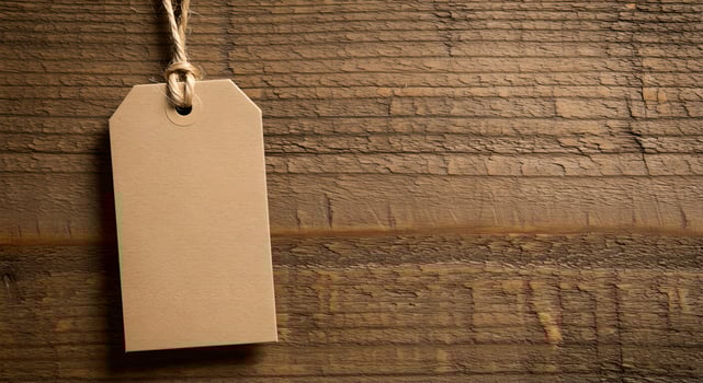 Beige gift tag on jute string against wood, earthy tones enhance handmade and organic branding mockups. photo