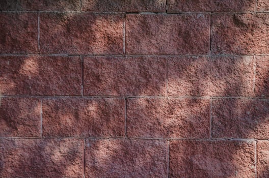 Red brick background with sun glare. High quality photo