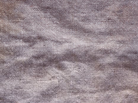 Rural texture of sackcloth. Background of very coarse, rough fabric woven made of flax, jute or hemp. Burlap bag material. Design element. photo