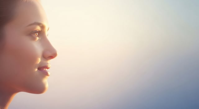 A woman is looking off into the distance photo