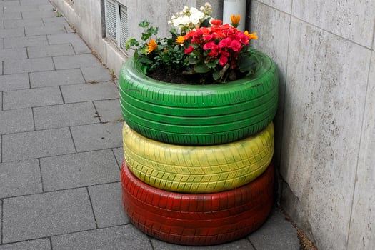 flowers inside colorful tires detail photo