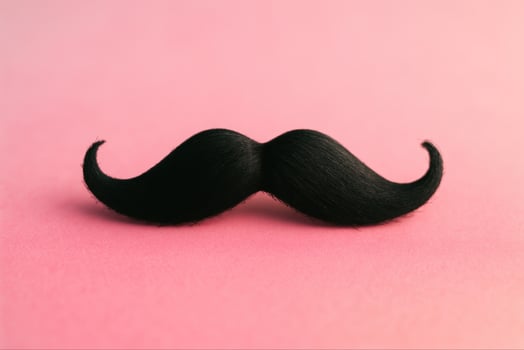 Black Moustache on Pink Canvas - Minimalist Design With Copy Space, Playful Movember Theme for Creative Projects and Social Media photo