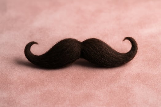 Quirky Mustache on Velvet Background Perfect for Stylish Movember Concepts and Creative Design Projects Focusing on Texture and Aesthetic Vibrancy in Stock Photography photo