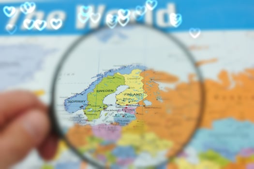 Following the map of northern Europe with a focus on Finland and Sweden through a magnifying glass photo