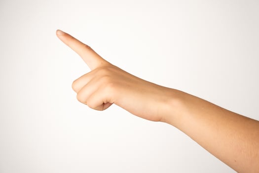 A human hand with extended index finger is isolated on a plain white background, showing a clear pointing gesture. Suitable for concepts involving direction, instruction, navigation, or user interface design. photo