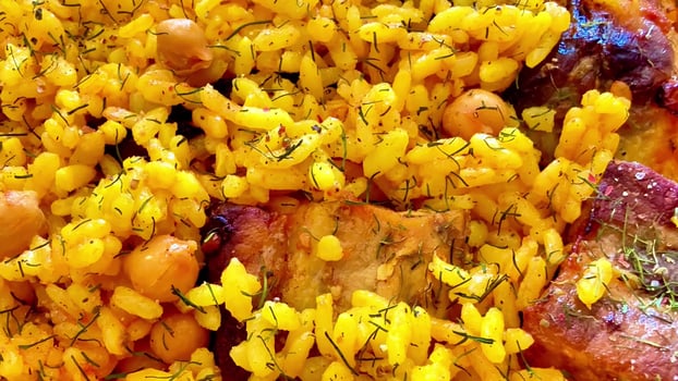 Savor the flavors of Delicious Yellow Rice with Chickpeas and tender Meat, a feast beloved by many photo