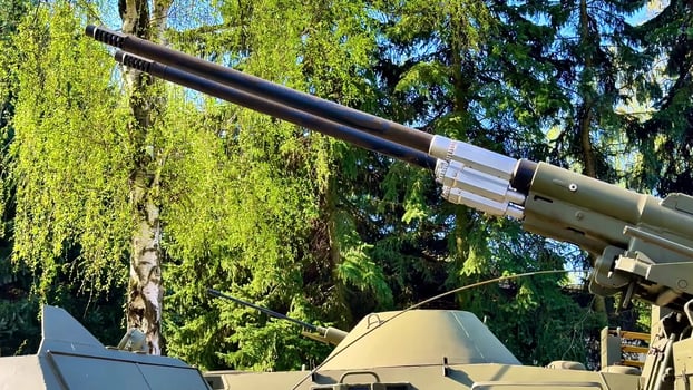 Closeup of a military tanks artillery in nature, highlighting its design and engineering photo