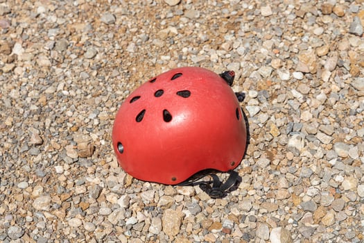 A red helmet on the orange and yellow stones background photo