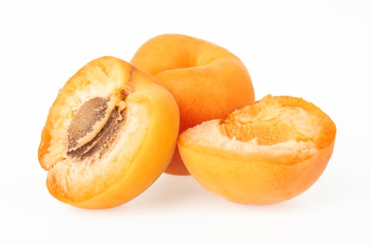 Apricot fruits on a white photo