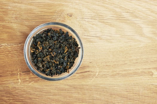 Tea in a bowl on wood photo