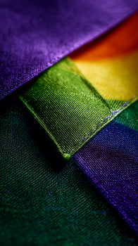 Vibrant Rainbow Fabric Texture Close Up with Dramatic Lighting. photo