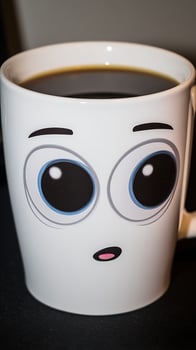 Surprised Coffee Mug with Big Eyes and Hot Coffee Inside. photo