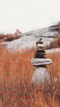 Balanced Rocks in Tall Grass Symbol of Peace and Nature. photo