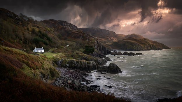 Isolated White Cottage On A Rocky Coast Under Dramatic Skies. photo