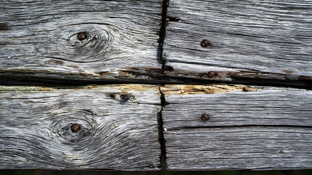Aged Wood Grain Texture with Rusty Nails and Cracks. photo