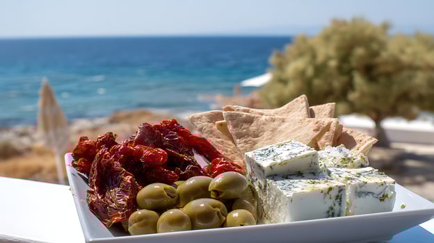 Delicious Mediterranean Mezze Platter Served Outdoors by the Sea. photo