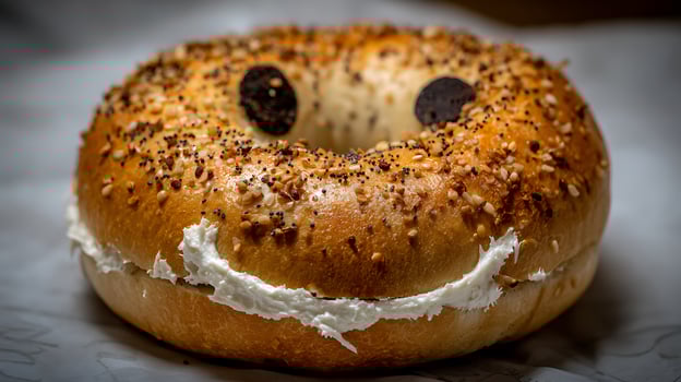 A Happy Everything Bagel with Cream Cheese Smiles. photo