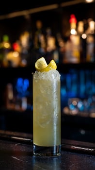 Refreshing Lemon Cocktail with Ice and Garnish on Bar Counter photo