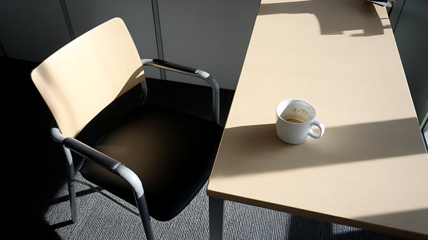 Empty Office Chair and Coffee Cup Bathed in Sunlight. photo