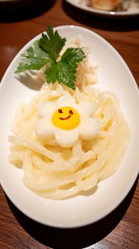 Fun Flower Shaped Noodle Dish with Happy Face Decoration. photo