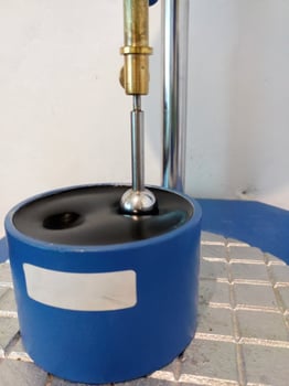 Ball penetration test on asphalt to measure the modulus resilience of asphalt mixtures. photo