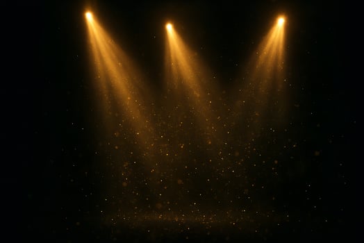 Golden light beams on a black background photo