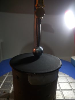 Ball penetration test on asphalt to measure the resilience of asphalt mixtures. photo